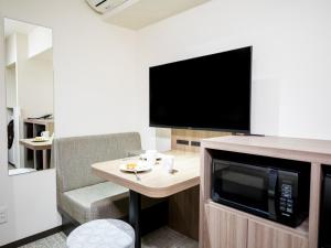 TV a/nebo společenská místnost v ubytování Tokyu Stay Nihonbashi