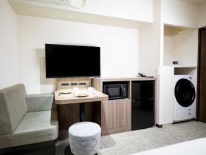 TV a/nebo společenská místnost v ubytování Tokyu Stay Nihonbashi