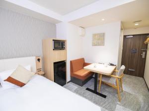 Postel nebo postele na pokoji v ubytování Tokyu Stay Nihonbashi