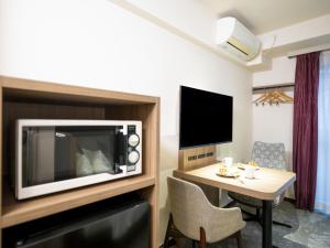 TV a/nebo společenská místnost v ubytování Tokyu Stay Nihonbashi