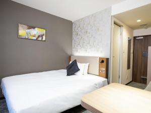 Postel nebo postele na pokoji v ubytování Tokyu Stay Nihonbashi