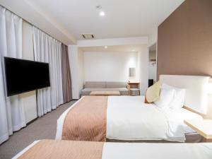 Postel nebo postele na pokoji v ubytování Tokyu Stay Nihonbashi