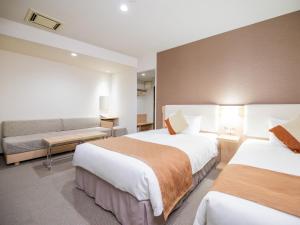 Postel nebo postele na pokoji v ubytování Tokyu Stay Nihonbashi