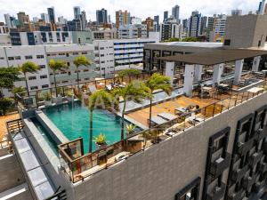 an overhead view of a swimming pool on a building at Arpoar Suítes by Day by Day in João Pessoa