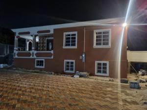 a house under construction at night with a street light at Historic Manor in Bridgetown +3 photos