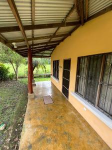 an outside view of a building with awning and a porch at Costa Rica Getaway in Jacó