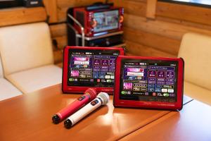 two red cell phones sitting on top of a table at 【Newly Opened】Yufuin Geihinkan Kura in Yufuin +29 photos