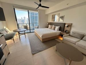 a bedroom with a bed and a living room at NEW Suite Downtown Miami - Amazing view 27th floor in Miami