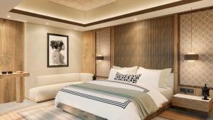 a bedroom with a bed and a chair in it at The One Boutique Villa & Spa Seminyak in Seminyak