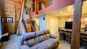 a living room with a couch and a table at Coalition Lodge in Park City