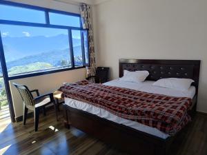 Postel nebo postele na pokoji v ubytování NAVRAJ homestay + 5 fotografií