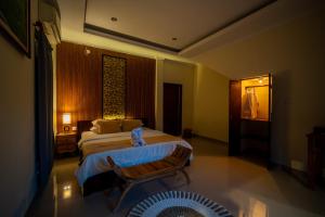 Postel nebo postele na pokoji v ubytování Alit Bungalow Ubud