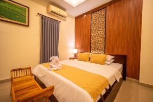 Postel nebo postele na pokoji v ubytování Alit Bungalow Ubud