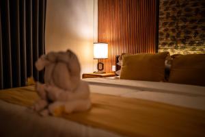 Postel nebo postele na pokoji v ubytování Alit Bungalow Ubud