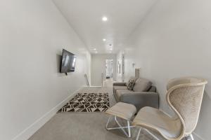 a living room with a couch and a chair at Villa #12 at Bloomington Country Club townhouse in St. George
