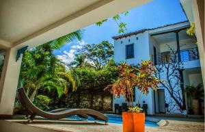 a view of a house with a swimming pool at Hotel Capilla del sol in Garzón