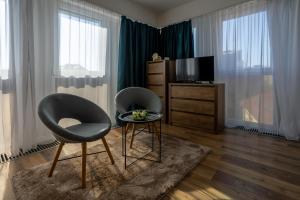 TV a/nebo společenská místnost v ubytování HelloWine Apartman II