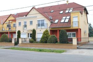 a row of houses on the side of a street at Harkány-Szt. István Apartman in Harkány