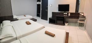 Postel nebo postele na pokoji v ubytování Hotel Eco Desaru