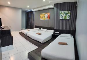 Postel nebo postele na pokoji v ubytování Hotel Eco Desaru