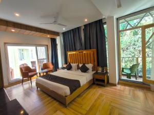 Ένα ή περισσότερα κρεβάτια σε δωμάτιο στο Luxury Inn by Stotrak Hotels