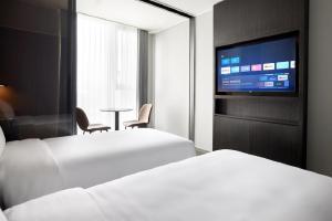 Krevet ili kreveti u jedinici u okviru objekta Homes Stay Myeongdong