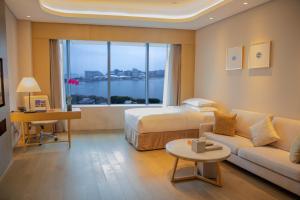 Voodi või voodid majutusasutuse Wyndham Grand Plaza Royale Yuzhou Xiamen Wuyuan Bay toas