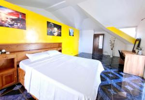 Postel nebo postele na pokoji v ubytování Villa Mauricienne à Calodyne - Piscine privée - 200m plage
