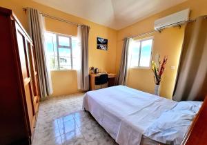 Postel nebo postele na pokoji v ubytování Villa Mauricienne à Calodyne - Piscine privée - 200m plage