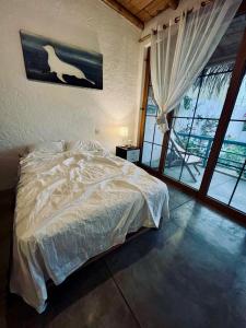 Ένα ή περισσότερα κρεβάτια σε δωμάτιο στο Casa Montemar