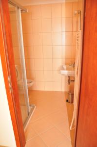 a bathroom with a toilet and a sink at Hotel Rudka in Kunštát