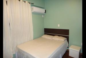Cama o camas de una habitación en Ajuricaba Suites 2