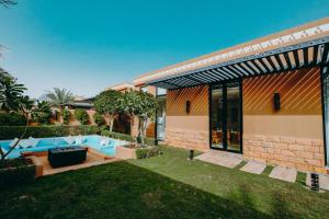 a backyard of a house with blue couches at Aseel Resort- Aseel Limited for Holiday Homes in Riyadh +35 photos