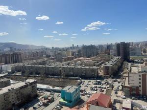 an aerial view of a city with buildings and cars at Oni's guest house in Ulaanbaatar