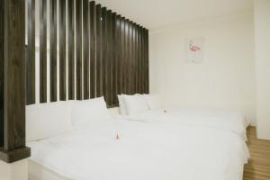 金金禮寓Solis hotel客房内的一张或多张床位