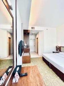 Postel nebo postele na pokoji v ubytování Seemsoon Hotel