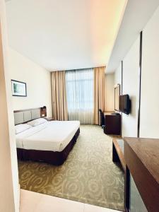 Postel nebo postele na pokoji v ubytování Seemsoon Hotel