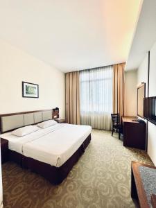 Postel nebo postele na pokoji v ubytování Seemsoon Hotel