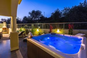 a jacuzzi tub sitting on top of a patio at D_Loft Sea and Golf in Albufeira