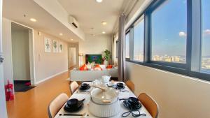 a room with a table and chairs with a view of a city at The Harmony Suite Hub SS2 in Petaling Jaya