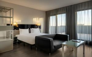 A bed or beds in a room at AC Hotel Atocha by Marriott