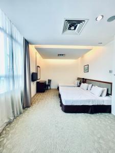 Postel nebo postele na pokoji v ubytování Seemsoon Hotel