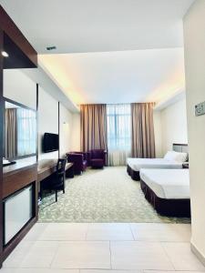Postel nebo postele na pokoji v ubytování Seemsoon Hotel