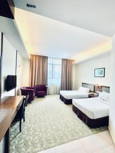 Postel nebo postele na pokoji v ubytování Seemsoon Hotel