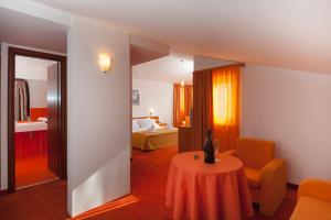 Ένα ή περισσότερα κρεβάτια σε δωμάτιο στο Hotel Rotondo
