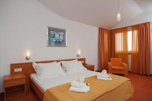 Ένα ή περισσότερα κρεβάτια σε δωμάτιο στο Hotel Rotondo