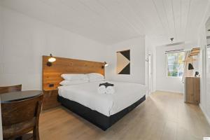 Postel nebo postele na pokoji v ubytování Triangle Motel + 37 fotografií