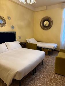 Postel nebo postele na pokoji v ubytování Hotel Guerrato
