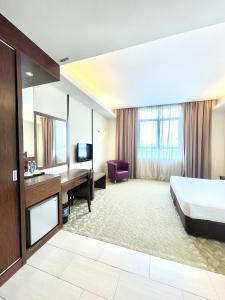 Postel nebo postele na pokoji v ubytování Seemsoon Hotel