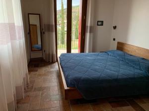 A bed or beds in a room at Agriturismo Tamellini